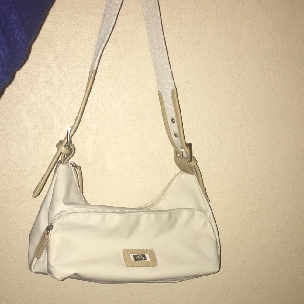 Small white but can accommodate to shoulder bag.